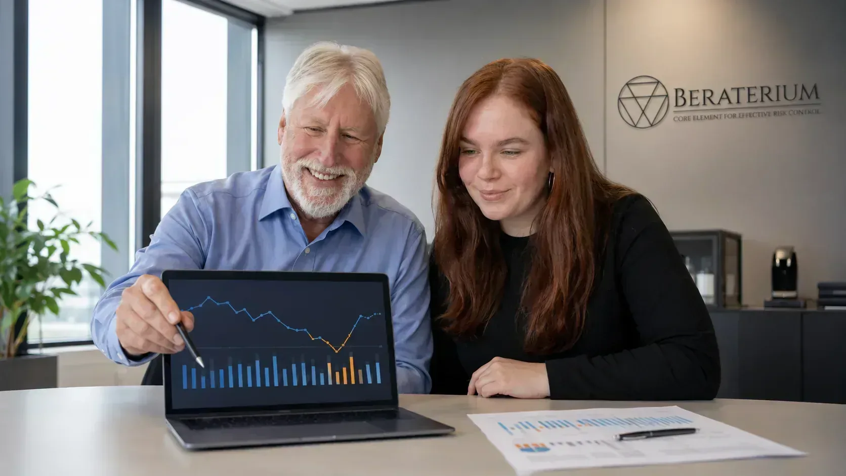 Business owner reviewing liquidity trends and cash flow metrics on a dashboard in the office